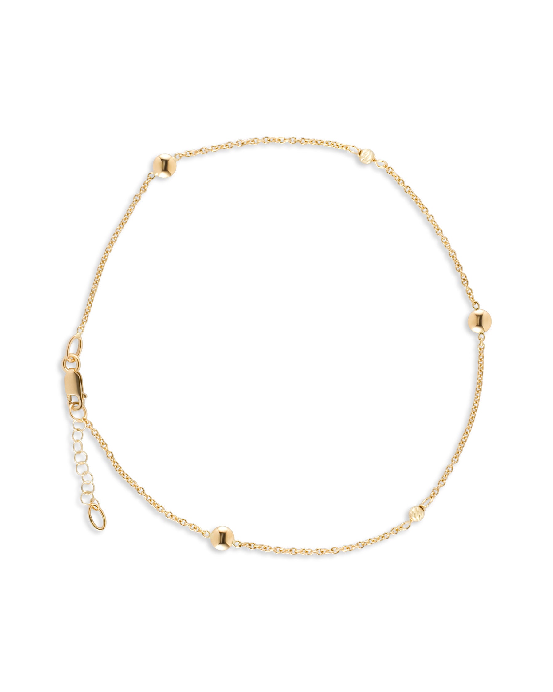 Radiate Elegance with Our 10K Gold Circle Pattern Anklet
